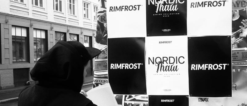 Person looking at a display of Rimfrost and Nordic Thalia products in a store window.
