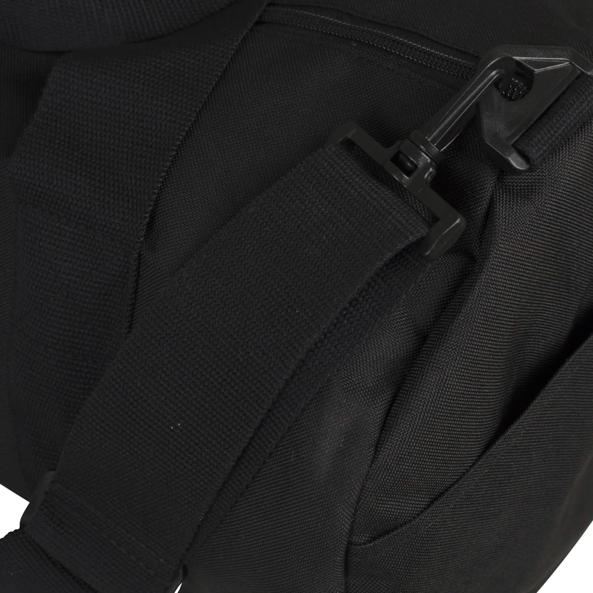 Close-up of a black backpack with straps on a white background