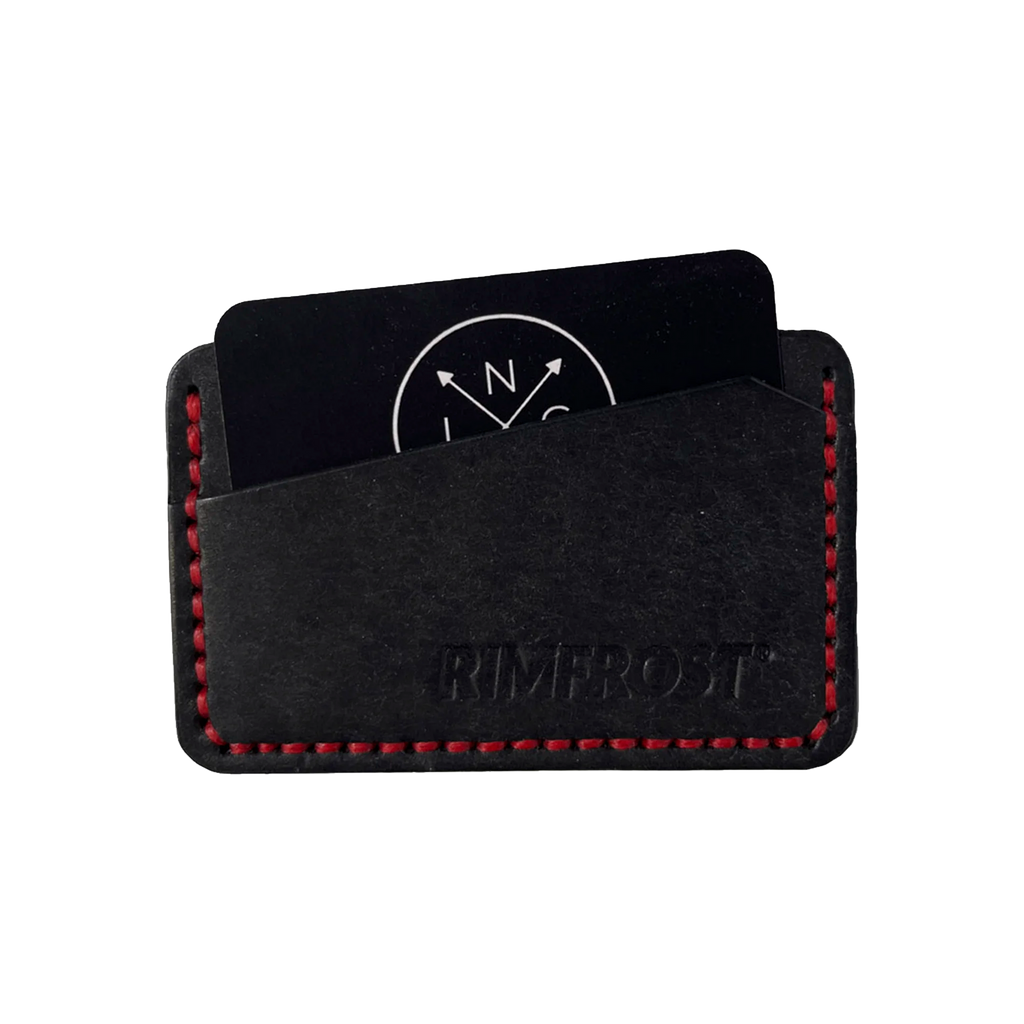 Black leather cardholder with red stitching on a white background