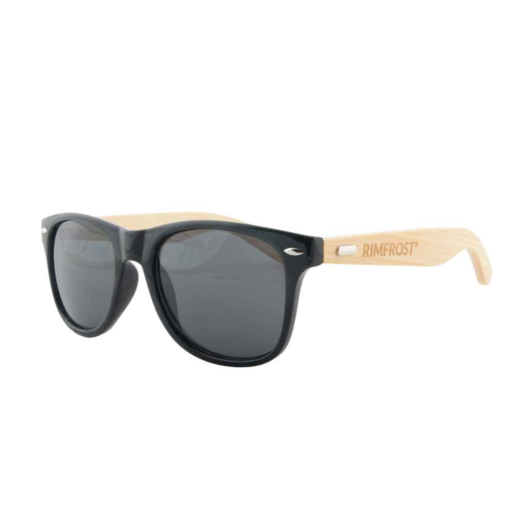 Sunglasses with black lenses and beige arms on a white background